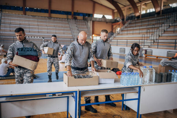 istock Soldiers preparing donations for civilians 1418514559