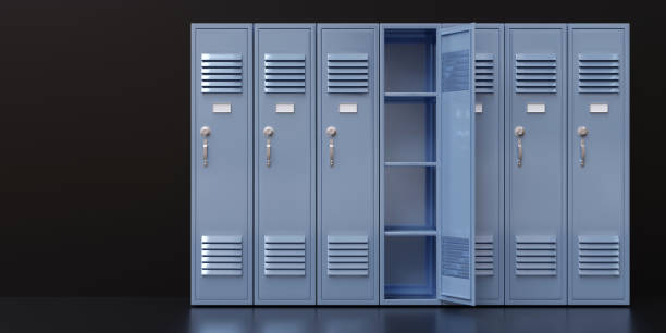 istock Gym locker, one open empty. School students storage closets on black floor 1418516088