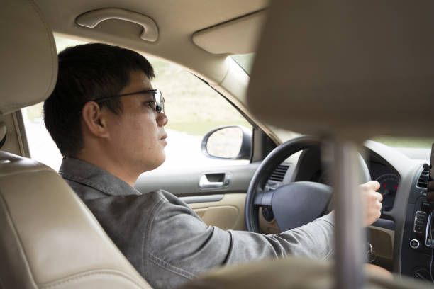 istock Asian men are driving seriously 1418523252