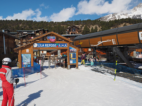 LA NORMA, FRANCE, MARCH 5, 2017: People using ski lift La Repose in sky resort La Norma Savoyan Alpes