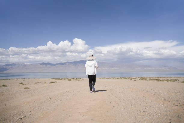 A man walking alone in the desert