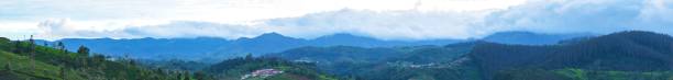istock Panoramic view of the clouds over mountains during sunrise 1418527945