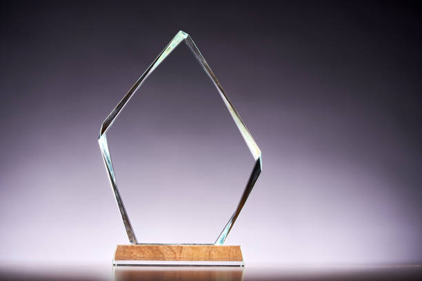 crystal trophy award against gray backgound
