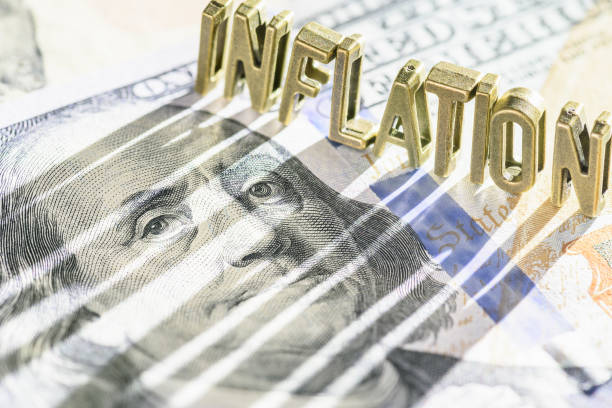 istock Inflation and consumer spending, financial concept : Word INFLATION on a US dollar note with a long shadow, depicting inflation that raise prices, lowering purchasing power, lowers currency valuation. 1418530162