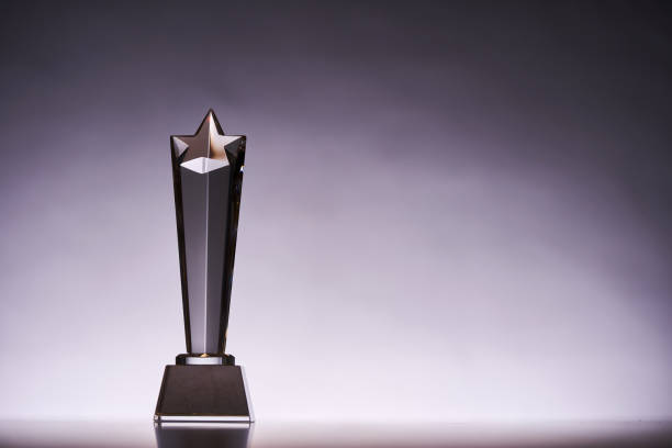 crystal trophy award against gray backgound