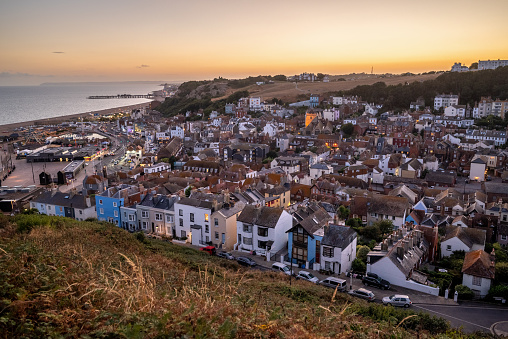 Wide angle view of Hastings old town at sunset. East Sussex, England, UK