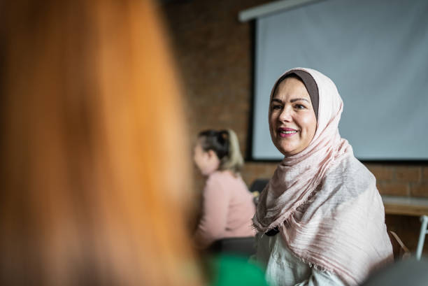 istock Colleagues talking in the classroom or workplace 1418536700