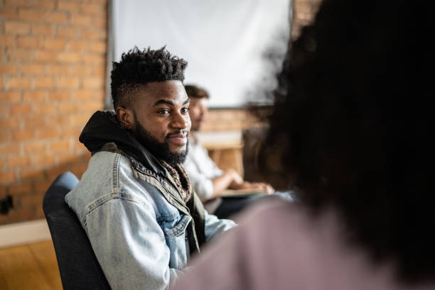 istock Adult students talking in the classroom 1418536746