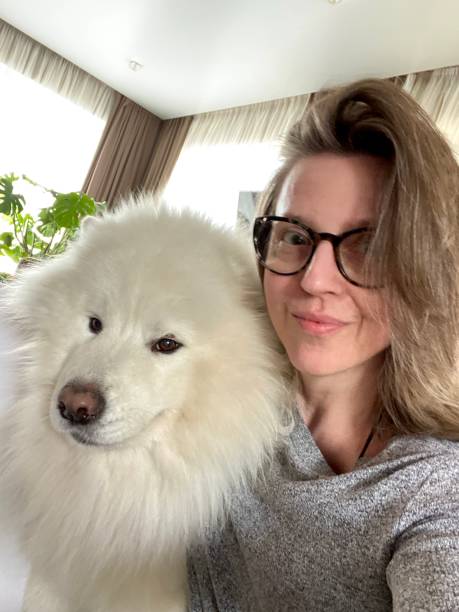 istock Woman with Samoyed dog self portrait 1418538920