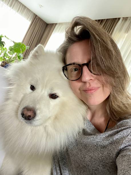 istock Woman with Samoyed dog self portrait 1418538921
