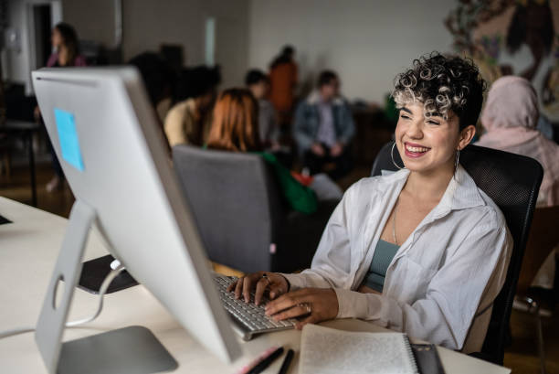 istock Young woman using the computer in the office/university 1418539158
