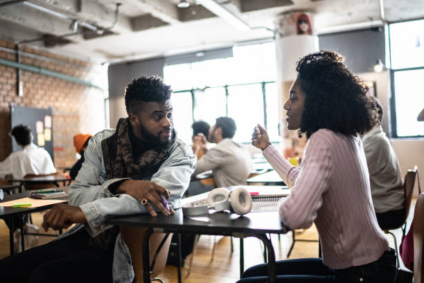 istock Colleagues talking in the classroom 1418540483