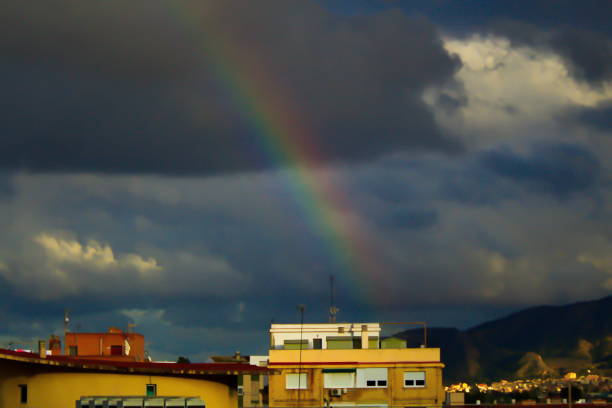 nice view of a colorful rainbow after the storm - weather meteorologist meteorology symbol imagens e fotografias de stock