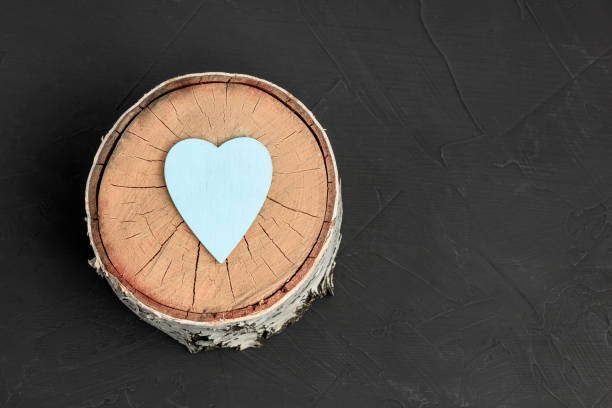 istock blue heart symbol on a round plan birch stump 1418541716