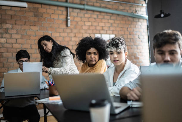 istock Colleagues studying together in the classroom 1418545409