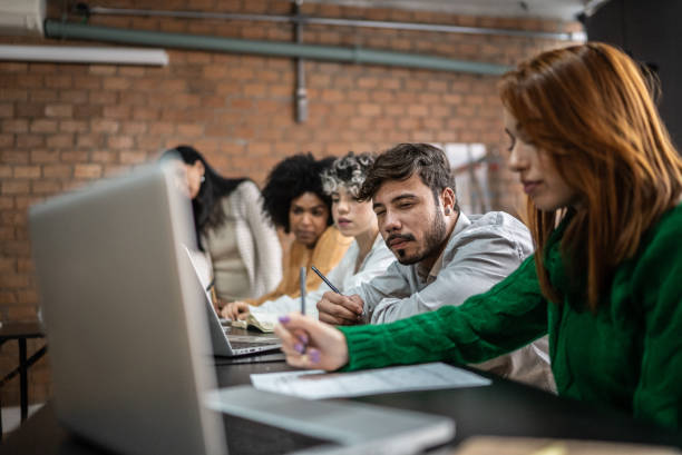 istock Colleagues studying together in the classroom 1418545487