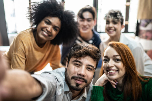 istock Students taking selfies in the classroom - point of view 1418546239