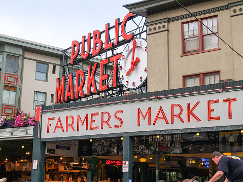 Seattle USA - July 20 2008; Pyke Place famous Farmers Market and tourist attraction providing artisan and specialty food and produce.with landmark clock at 8.00