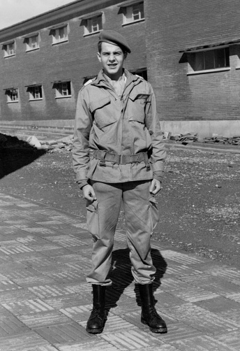 Black and White Image from the 70s: smiling young soldier looking at the camera