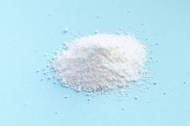 istock Washing detergent powder pile on blue background 1418560298