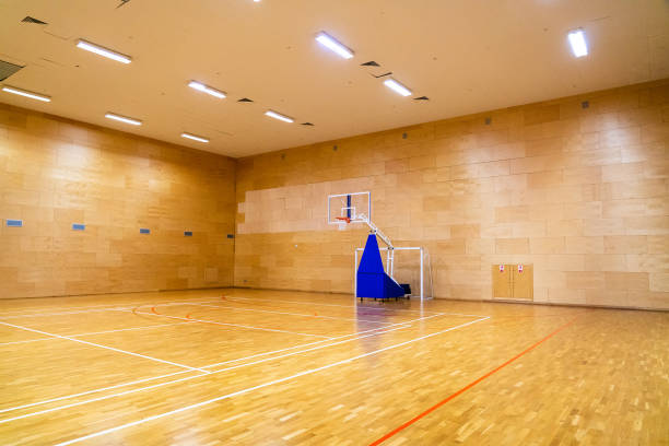 istock Light basketball gym with movable basket without people 1418560379
