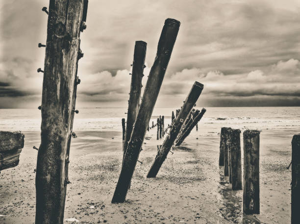 istock Spurn Point groynes weathered and eroded, coastal erosion 1418560440