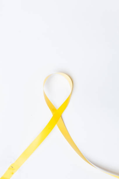 yellow ribbon, symbol against suicide prevention, symbol of hope, amber alert yellow ribbon, symbol against suicide prevention, symbol of hope, amber alert and parenting isolated on white background with space for text amber alert ribbon stock pictures, royalty-free photos & images