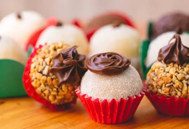 Photo of Brazilian gourmet brigadeiro in close-up photography. Brazilian food, dessert. Traditional sweet in Brazil at parties and events.