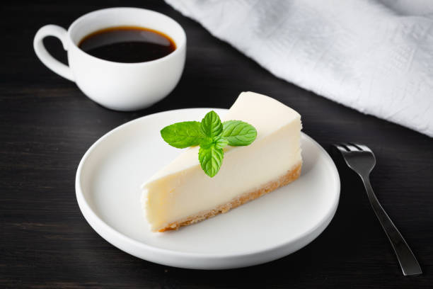istock Classical New York Style Cheesecake And Coffee On Table. Side View. Coffee and Cake 1418570470