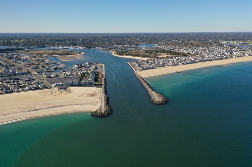 A drone shot of the Manasquan Inlet in New Jersey, on a bright sunny day
