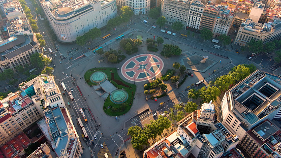 Plaça de Catalunya is a large square in central Barcelona that is generally considered to be both its city centre and the place where the old city (Barri Gòtic and Raval, in Ciutat Vella) and the 19th century-built Eixample meet.