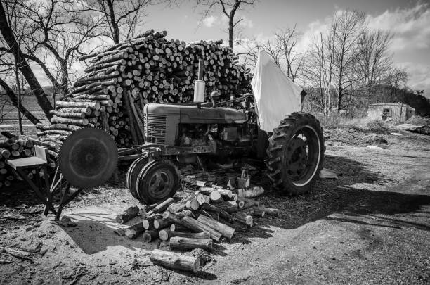 istock Ghost on tractor in front of log pile 1418574532