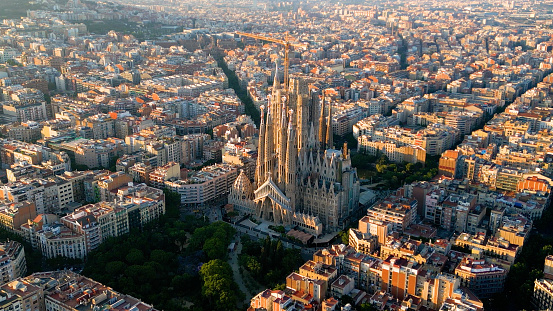 Barcelona Eixample residential district and famous Basilica Sagrada Familia at sunset. Catalonia, Spain