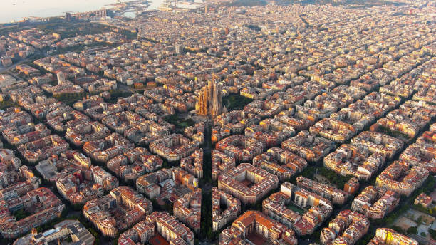 Aerial view of Barcelona Eixample residential district and famous Basilica Sagrada Familia at sunrise. Catalonia, Spain Aerial view of Barcelona, Spain. Blocks with multiple residential buildings and Sagrada Familia. barcelona stock pictures, royalty-free photos & images