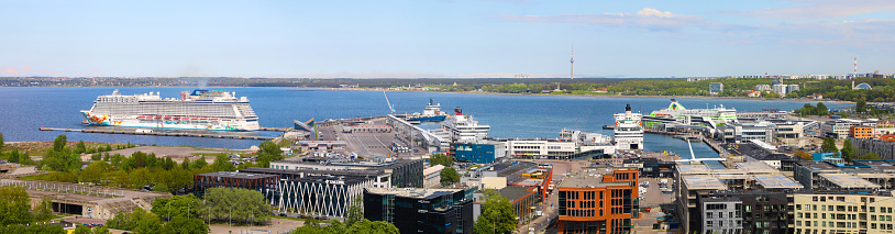 Panoramic view of the colorful and busy cruise ship port of Tallinn in the spring