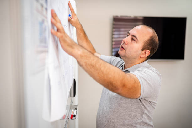 istock Senior a man works in an office 1418582572