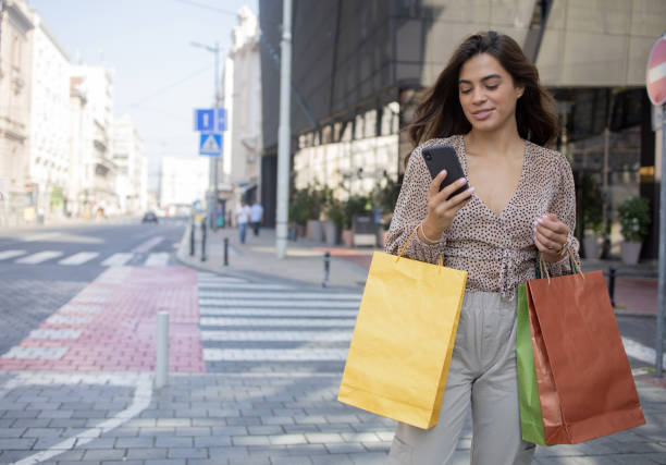 istock Young woman coming back from shopping 1418597637