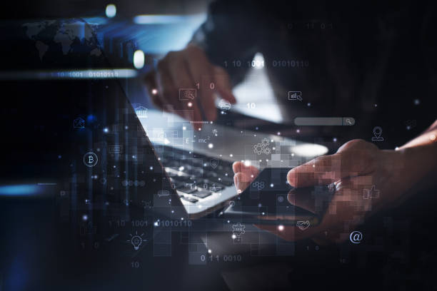 istock IoT, Internet of Things, digital marketing, E-commerce, global business, digital technology concept. Man using mobile phone and laptop for online working and searching data 1418598077