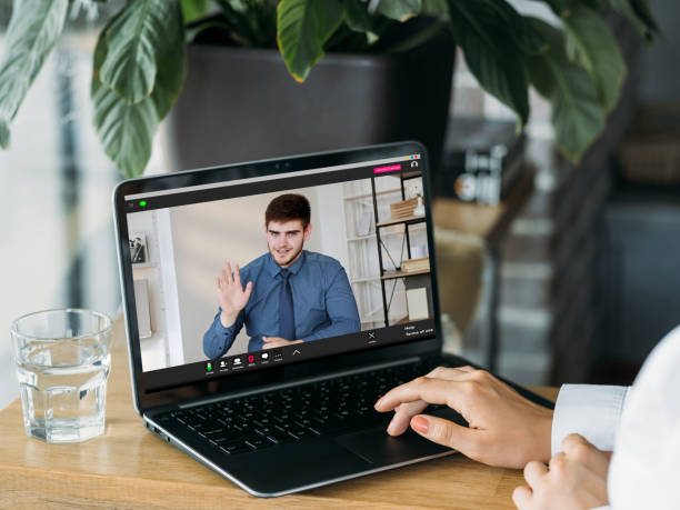 istock video interview digital meeting employee laptop 1418600654