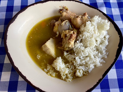 Dominican Republic - Sancocho with rice. Chicken soup (and other meats and vegetables) served with white rice. Typical dish of the Dominican Republic