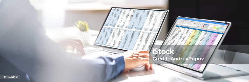 Analyst Working With Spreadsheet Business Data Analyst Working With Spreadsheet Business Data On Computer 30-34 Years Stock Photo