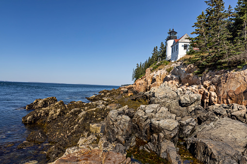 Bass Harbor Head Lighthouse was built in 1858 on a stone foundation and stands 56 feet above the Atlantic Ocean in Maine.
