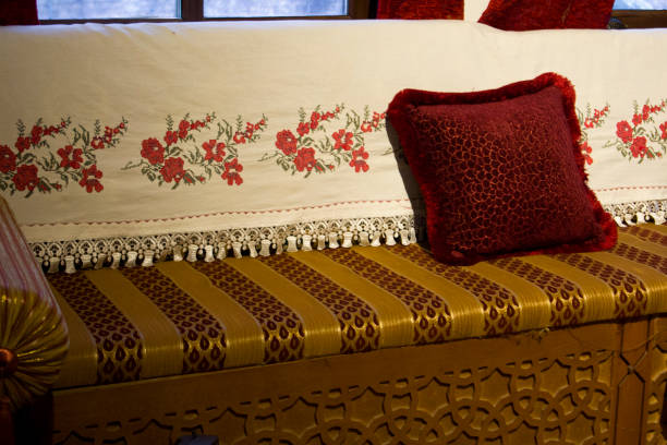 istock Ethnic pillows and carved wooden sofa 1418613837