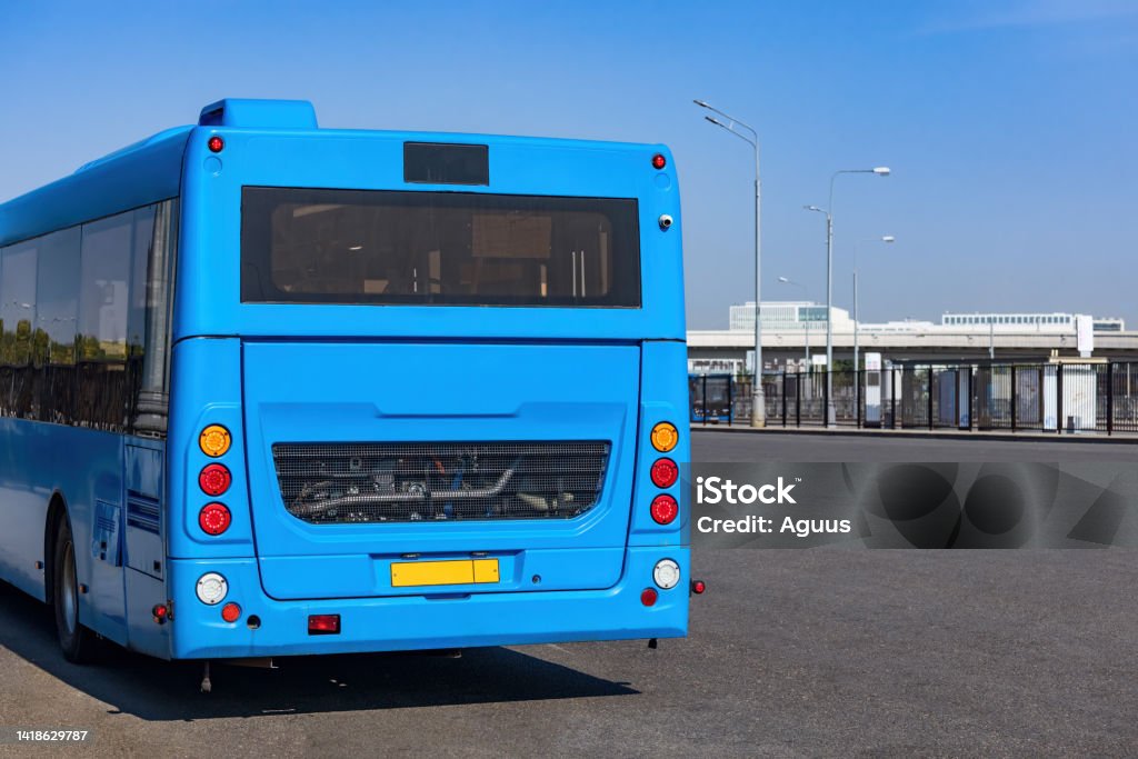 Blue electric bus on the public transport station Auto Repair Shop Stock Photo