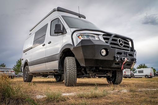 Loveland, CO, USA - August 26, 2022: 4x4 camper van on Mercedes Sprinter chassis with upgraded front bumper and winch for off-road overlanding.