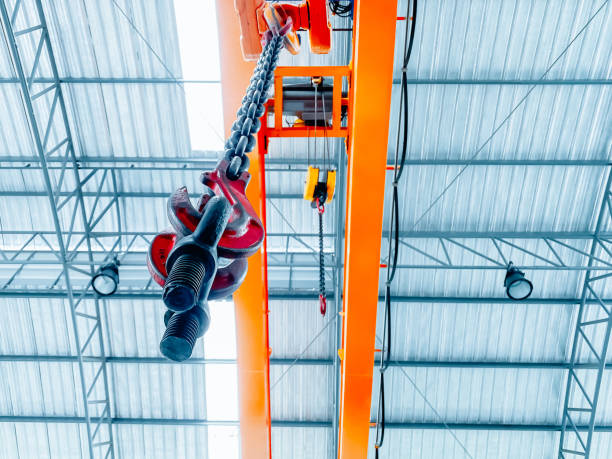 overhead crane inside factory building, industrial background. - pulley hook crane construction imagens e fotografias de stock