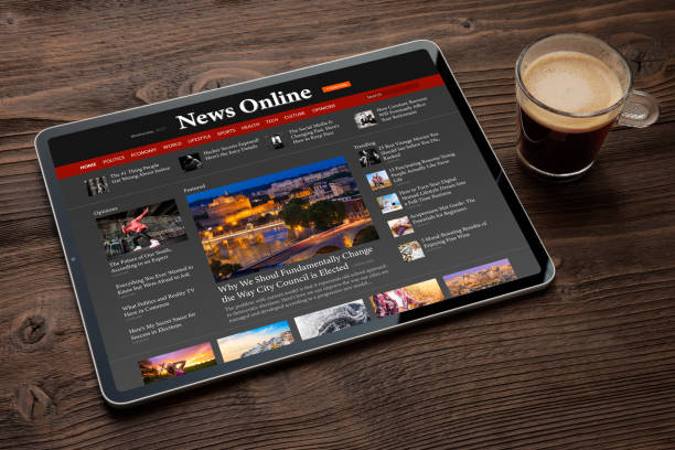 istock Sample news website shown on digital tablet 1418649735