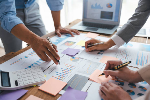 istock Group of business people brainstorm together to work presenting new ideas and projects. 1418650429