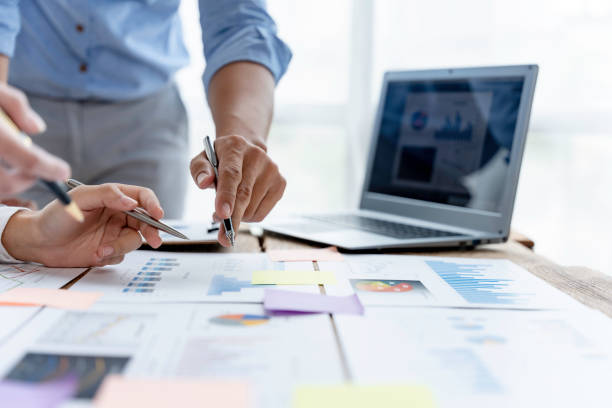 istock Business people meeting working with talk, consult, discuss working with new startup project idea presentation analyze plan marketing and investment in the office. 1418652031