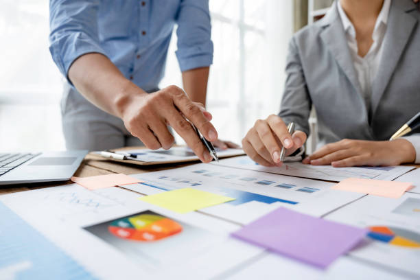istock Business people meeting working with talk, consult, discuss working with new startup project idea presentation analyze plan marketing and investment in the office. 1418652038